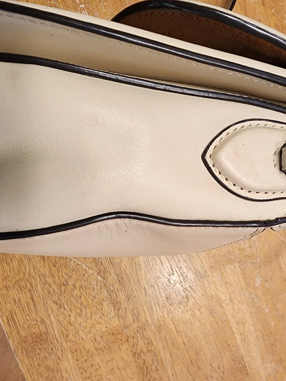 2021 Ivory Coach Beat saddle bag is crafted from glovetanned leather and brass